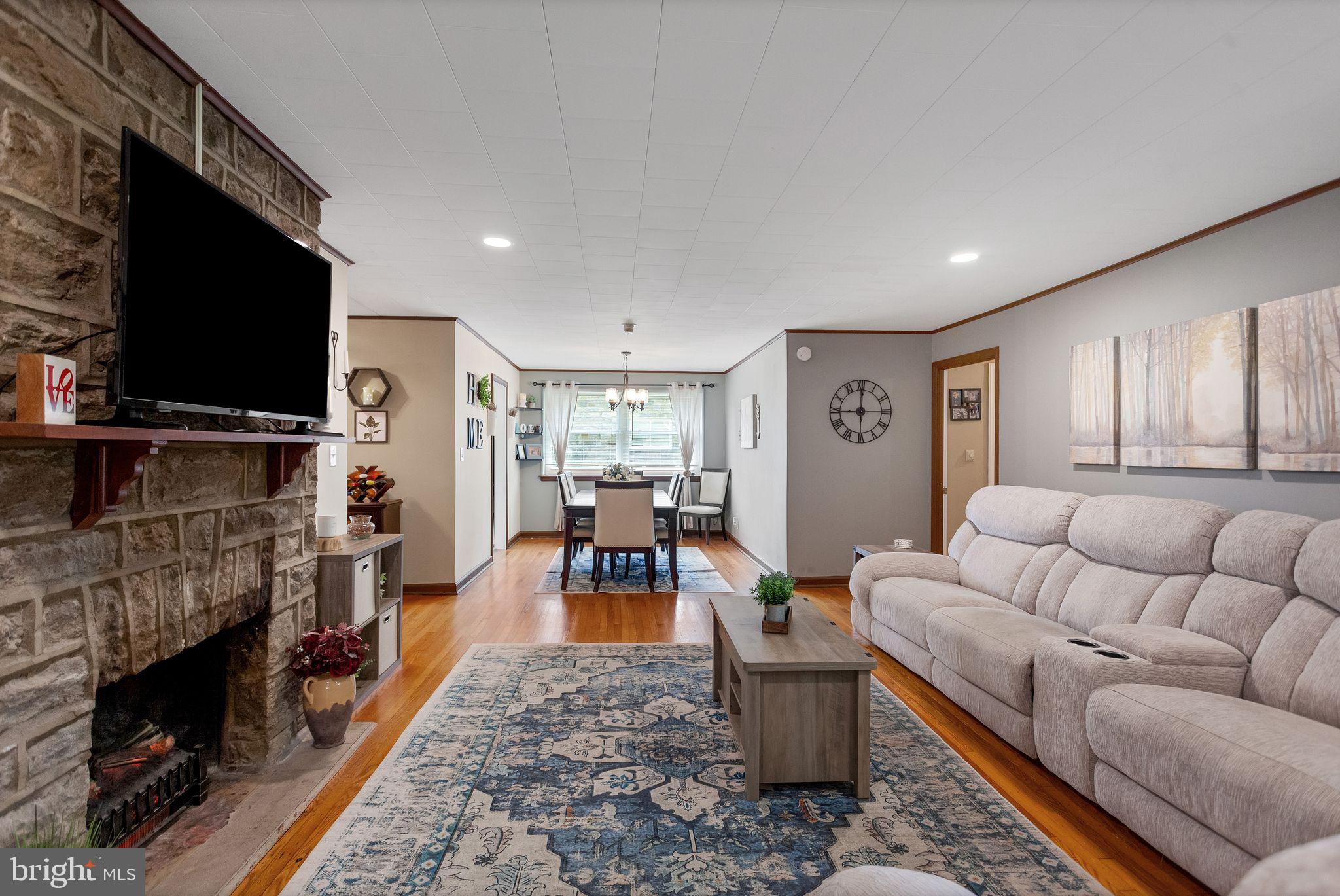 Living room with wood fireplace.