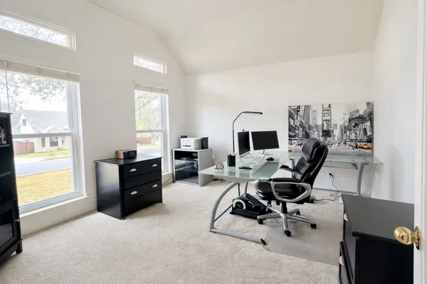 a large kitchen with stainless steel appliances wooden cabinets and a sink