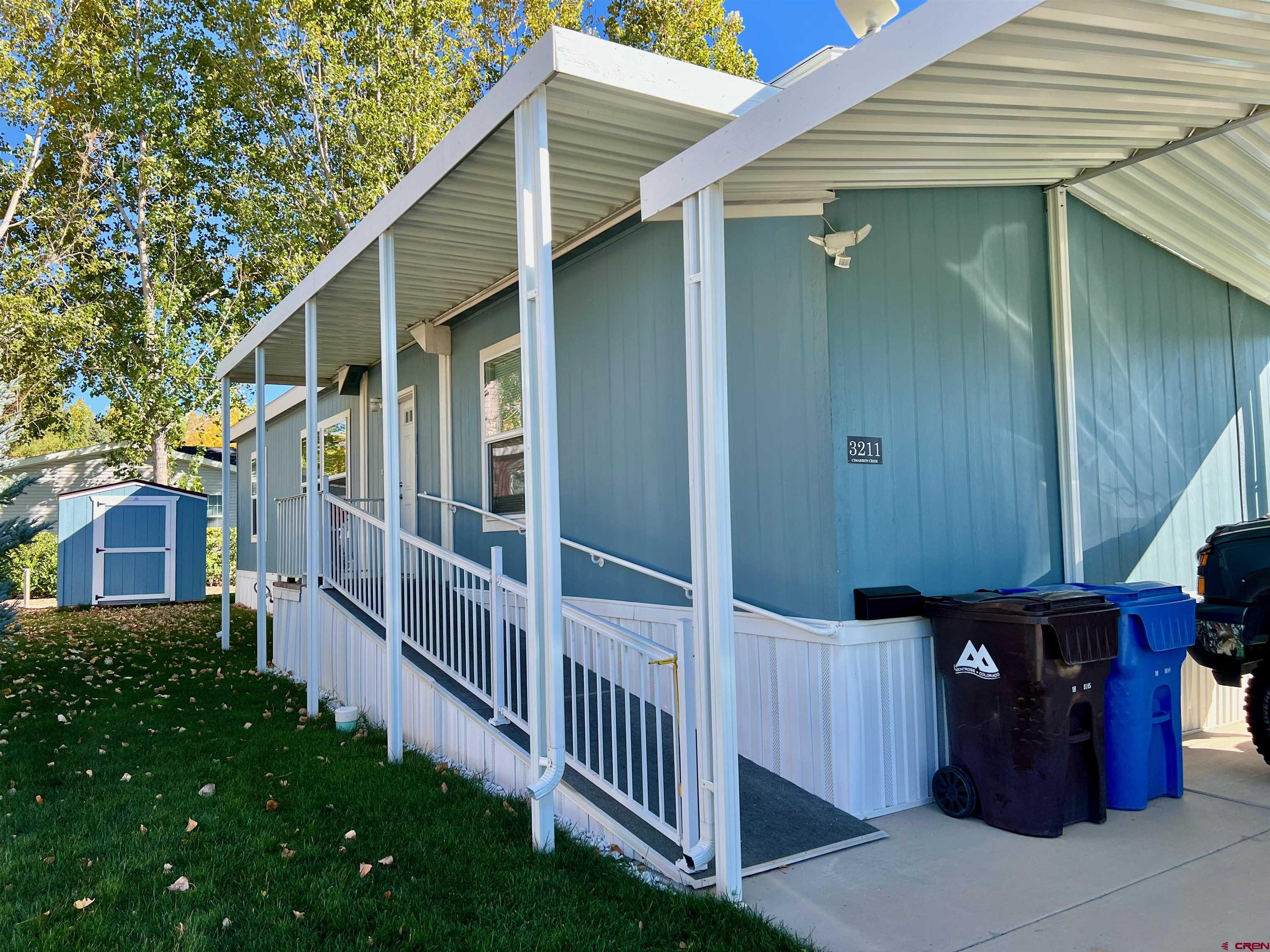 901 6530 Road, Unit 3211 Montrose, CO 81401 - Photo 1 of 34 a view of a house with backyard and porch