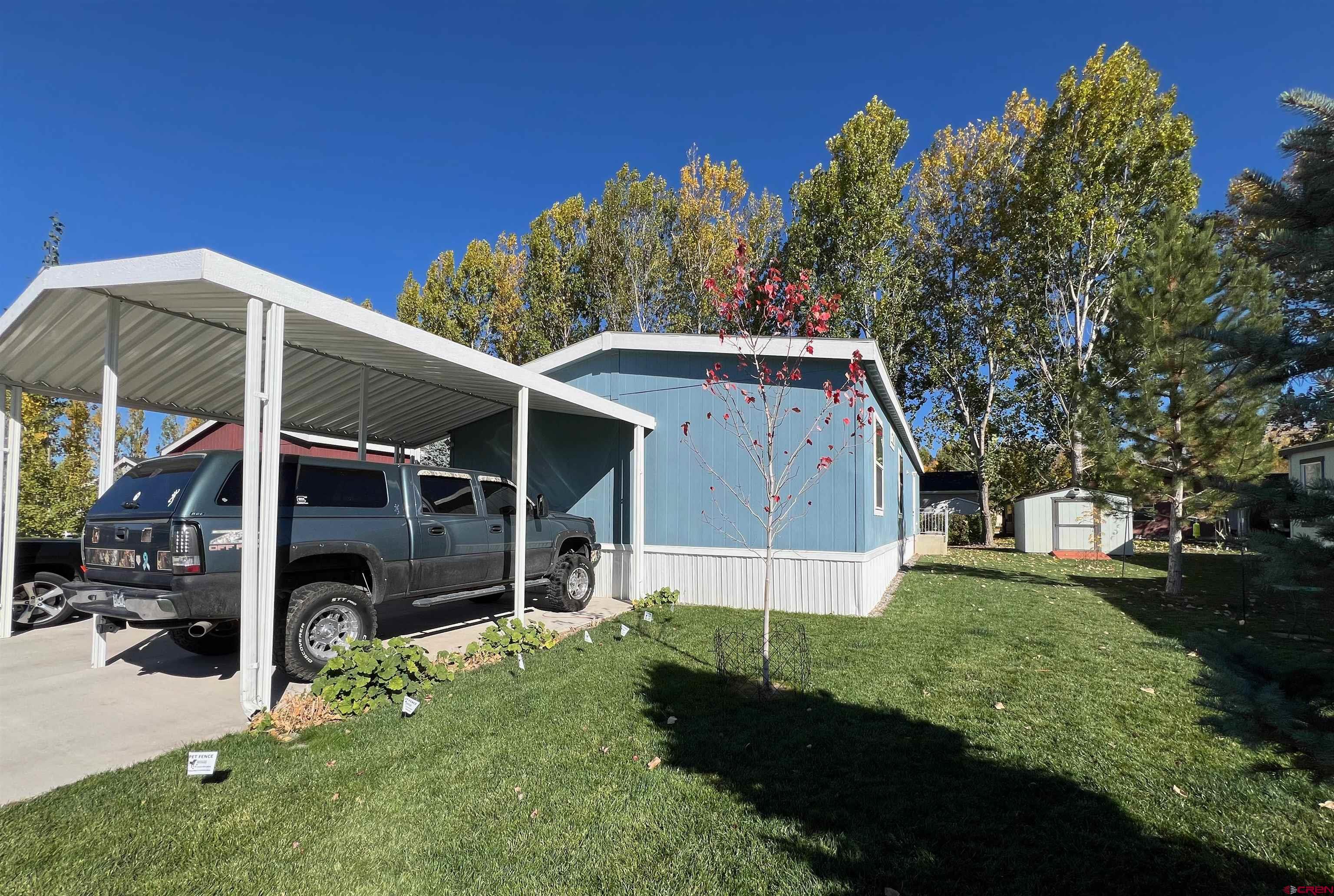 901 6530 Road, Unit 3211 Montrose, CO 81401 - Photo 2 of 34 a view of house with backyard
