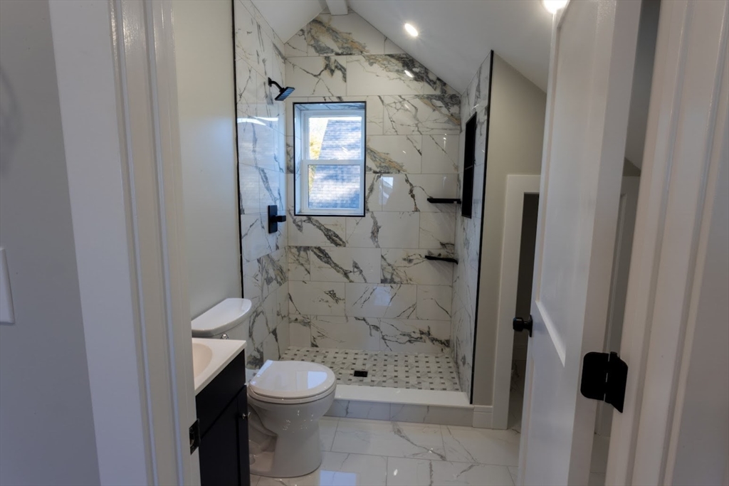 75 Sycamore Street Everett, MA 02149 - Photo 20 of 25 a bathroom with a toilet and a shower