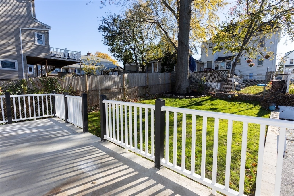75 Sycamore Street Everett, MA 02149 - Photo 21 of 25 a view of a house with wooden fence