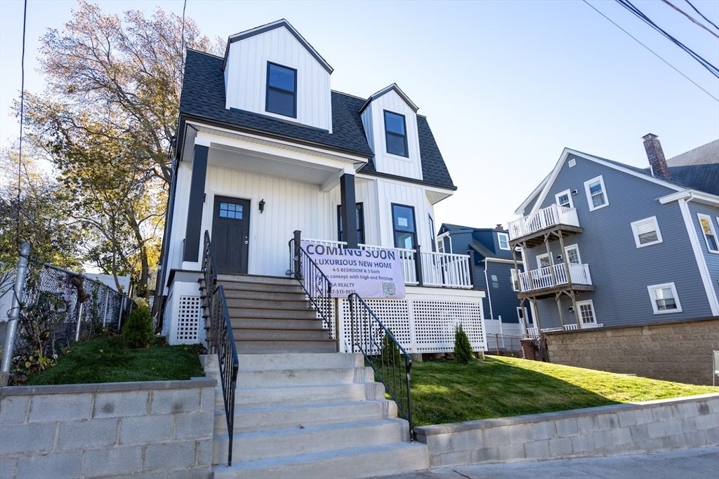 75 Sycamore Street Everett, MA 02149 - Photo 25 of 25 a front view of a house with a yard