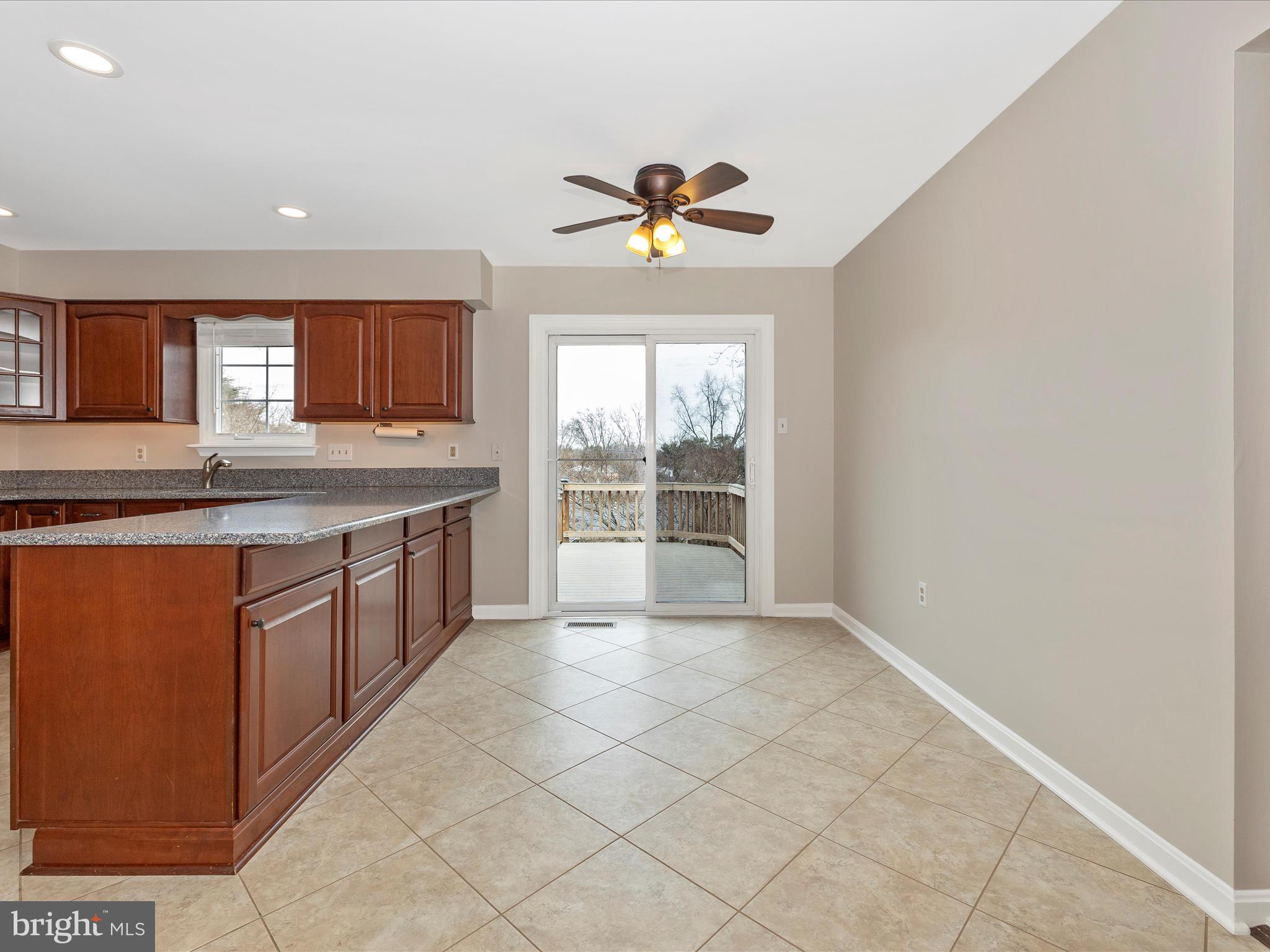 24217 Welsh Road Gaithersburg, MD 20882 - Photo 12 of 65 There is a large composite deck just outside