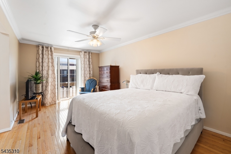 488 Auten Road, Unit 2D Hillsborough, NJ 08844 - Photo 15 of 30 a spacious bedroom with a bed and a chandelier