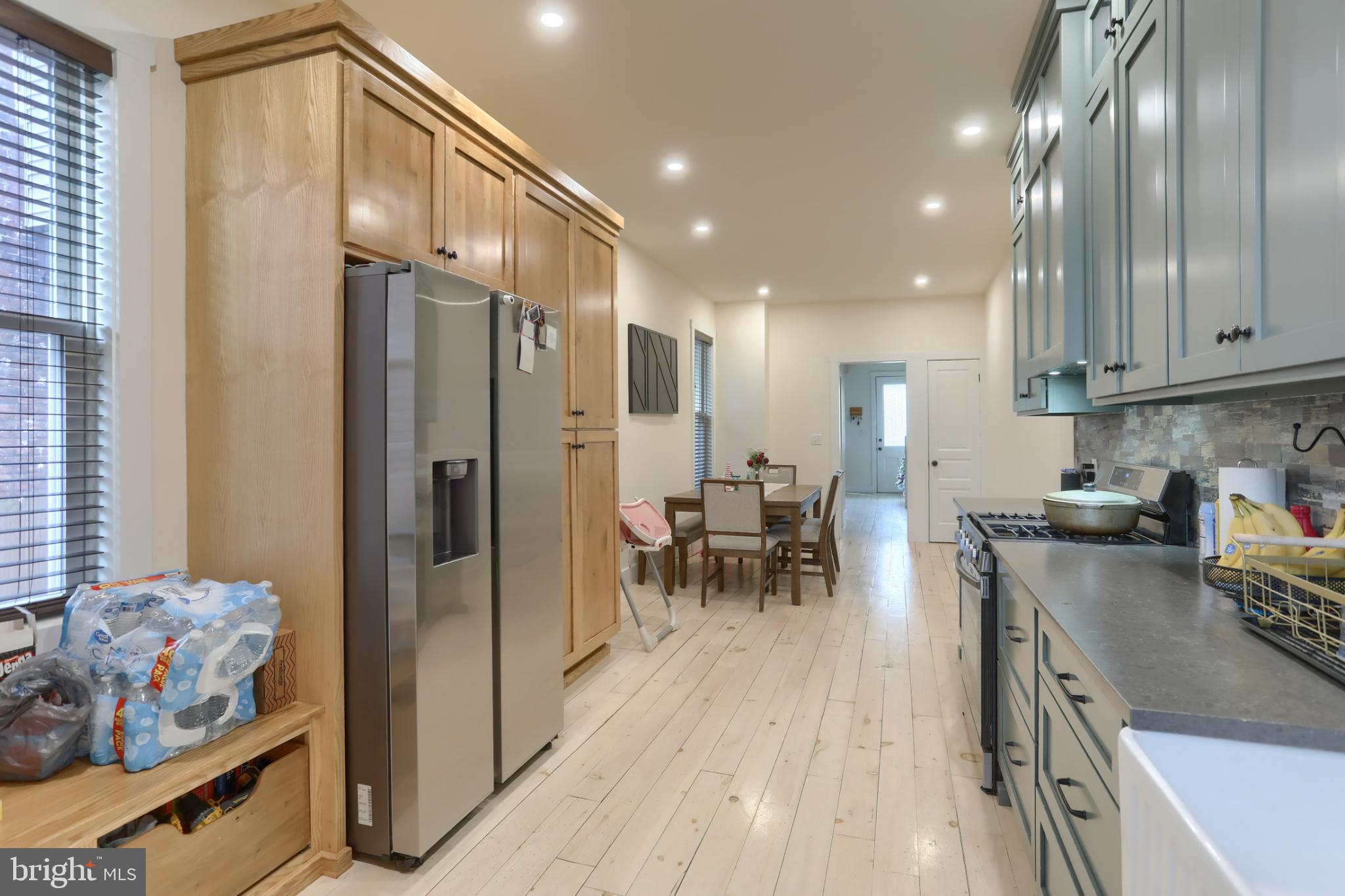 140 South 8th Street Lebanon, PA 17042 - Photo 16 of 34 a kitchen with stainless steel appliances granite countertop a refrigerator a stove and a sink with wooden floor