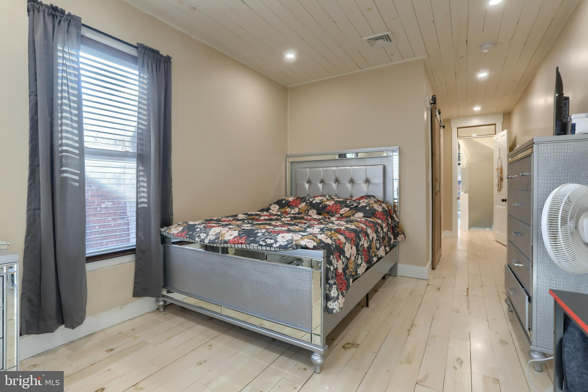 140 South 8th Street Lebanon, PA 17042 - Photo 20 of 34 a bed sitting in a bedroom next to a balcony