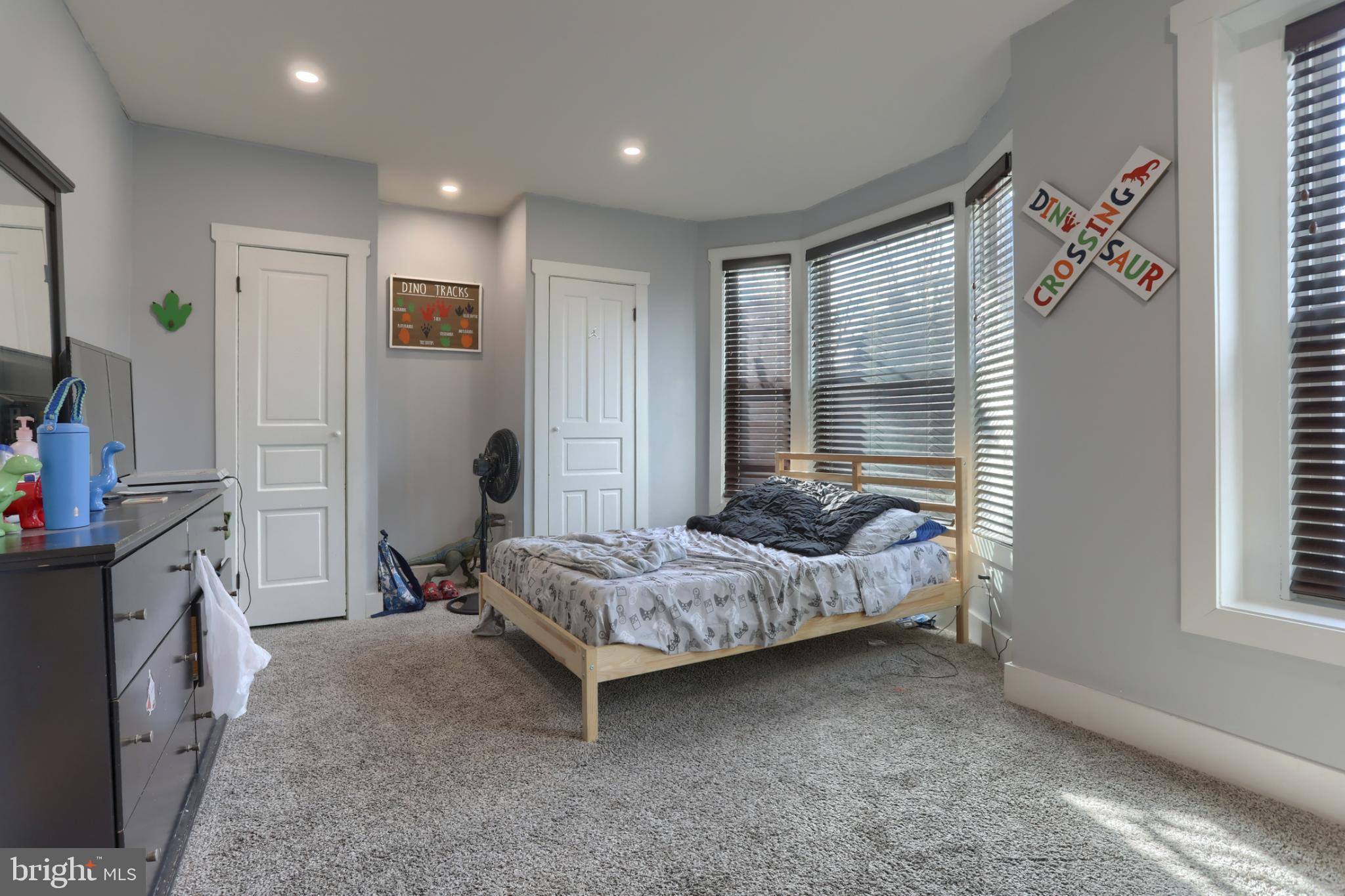 140 South 8th Street Lebanon, PA 17042 - Photo 23 of 34 a bedroom with a bed and a flat tv screen on dresser