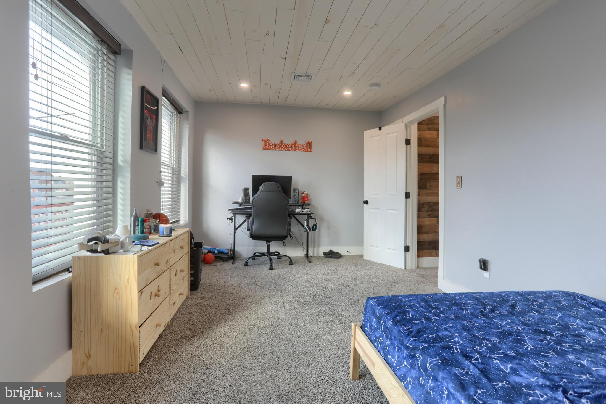 140 South 8th Street Lebanon, PA 17042 - Photo 30 of 34 a living room with a couch and a dresser next to a window