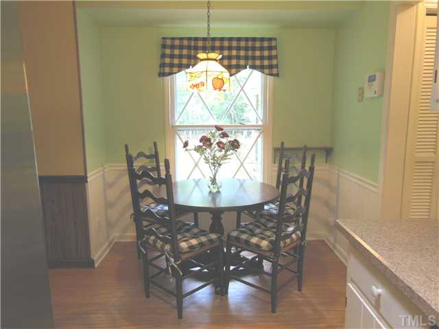 1115 Briardale Road Durham, NC 27712 - Photo 13 of 25 a view of a dining room with furniture a chandelier and window
