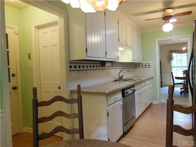 1115 Briardale Road Durham, NC 27712 - Photo 15 of 25 a spacious bathroom with a granite countertop sink a mirror and shower