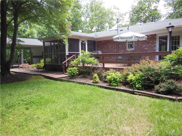 1115 Briardale Road Durham, NC 27712 - Photo 23 of 25 a view of a house with backyard sitting area and garden