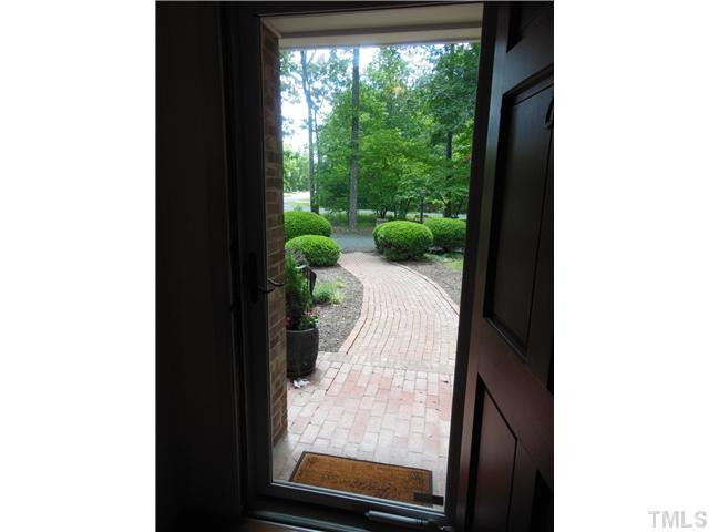 1115 Briardale Road Durham, NC 27712 - Photo 3 of 25 a view of a floor to ceiling window and a yard