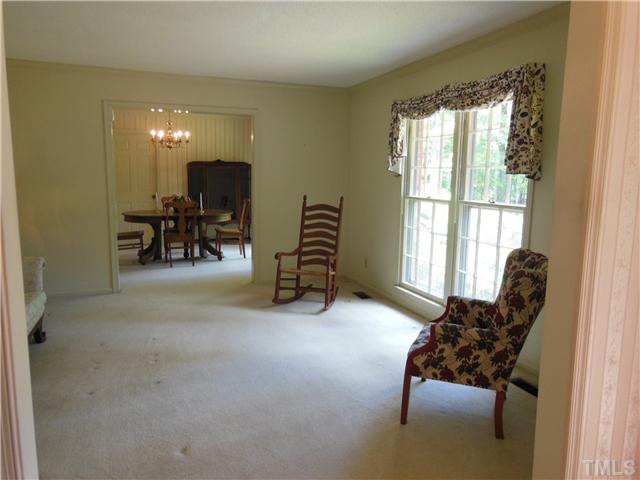 1115 Briardale Road Durham, NC 27712 - Photo 4 of 25 a living room with furniture and a flat screen tv