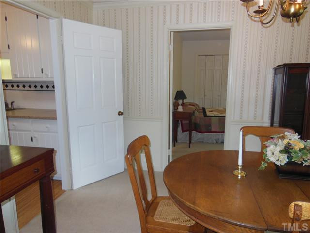 1115 Briardale Road Durham, NC 27712 - Photo 7 of 25 a dining room with furniture and wooden floor