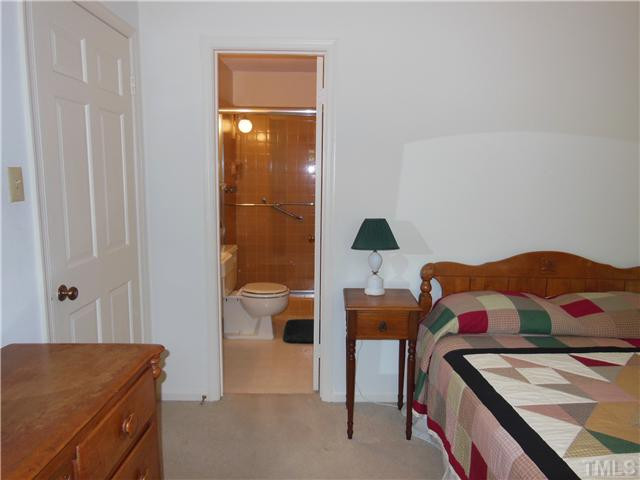 1115 Briardale Road Durham, NC 27712 - Photo 9 of 25 a bedroom with a bed and a dresser