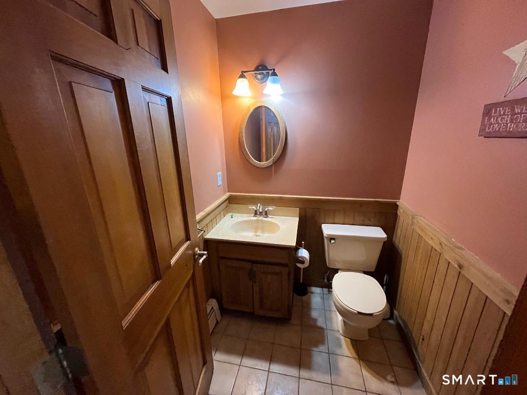 37 Potter School Road Willington, CT 06279 - Photo 14 of 31 a bathroom with a toilet a sink and a mirror