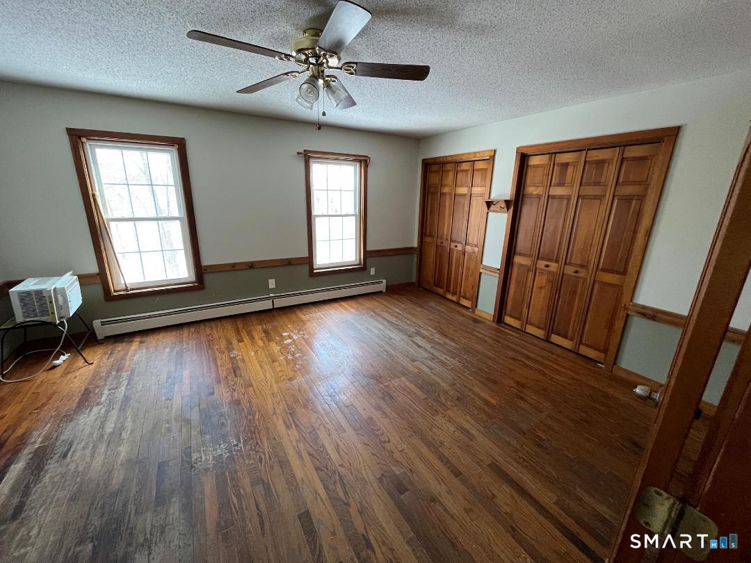37 Potter School Road Willington, CT 06279 - Photo 19 of 31 a view of an empty room with wooden floor and a window