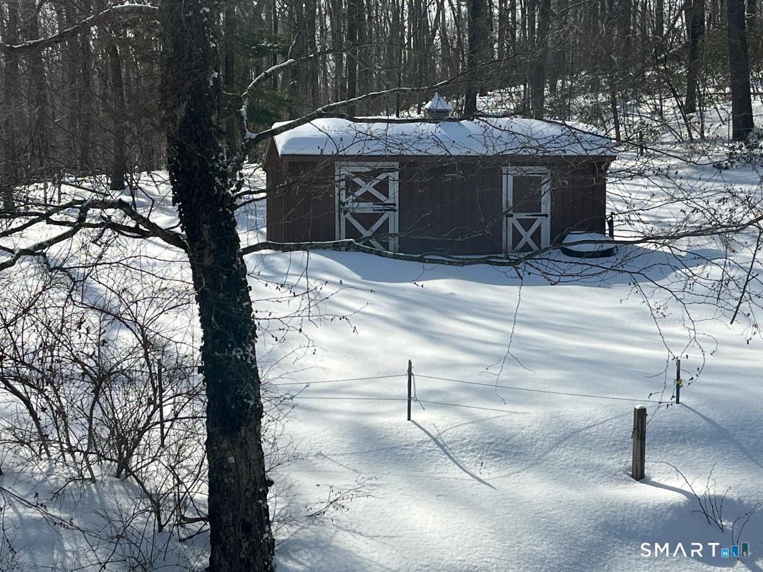 37 Potter School Road Willington, CT 06279 - Photo 31 of 31 a view of a backyard with table and chairs