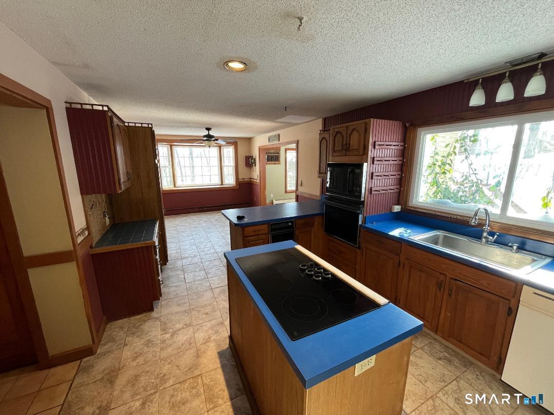 37 Potter School Road Willington, CT 06279 - Photo 10 of 31 a kitchen with stainless steel appliances granite countertop a sink stove and refrigerator