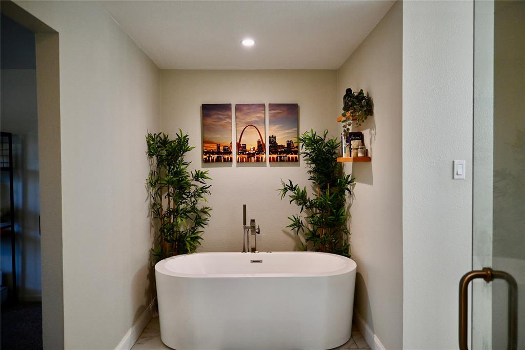 2223 Ridgedale Drive Carrollton, TX 75006 - Photo 12 of 27 a bathroom with a sink and mirror