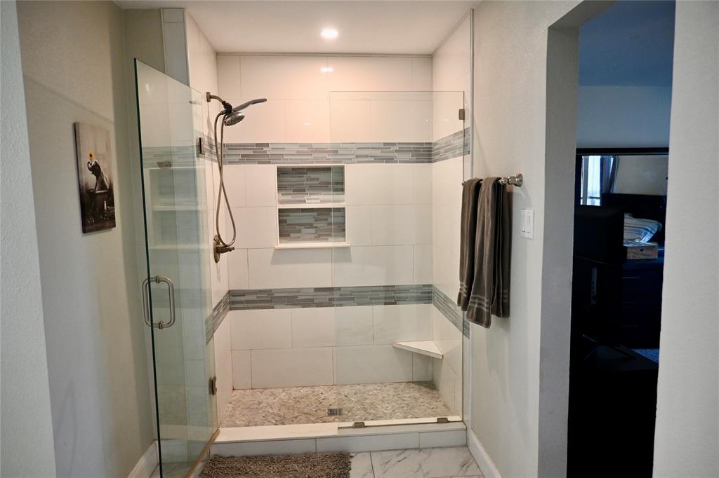 2223 Ridgedale Drive Carrollton, TX 75006 - Photo 13 of 27 a bathroom with a shower