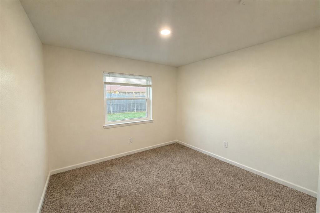 2223 Ridgedale Drive Carrollton, TX 75006 - Photo 20 of 27 an empty room with a window