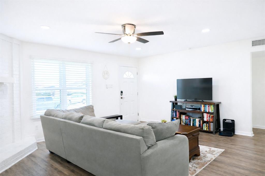 2223 Ridgedale Drive Carrollton, TX 75006 - Photo 2 of 27 a living room with furniture and a flat screen tv