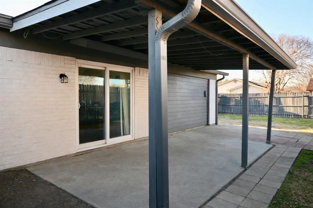 2223 Ridgedale Drive Carrollton, TX 75006 - Photo 23 of 27 a view of a backyard of a house