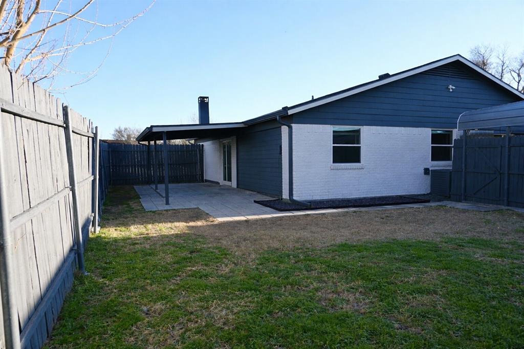 2223 Ridgedale Drive Carrollton, TX 75006 - Photo 25 of 27 a backyard of a house with lots of green space