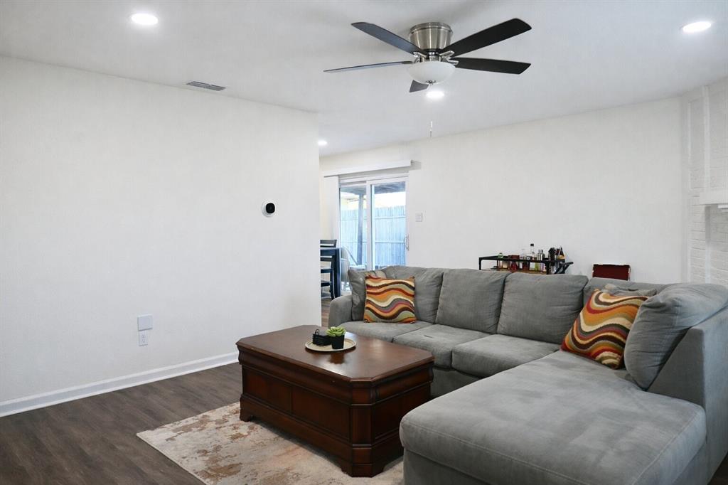 2223 Ridgedale Drive Carrollton, TX 75006 - Photo 3 of 27 a living room with furniture and a wooden floor