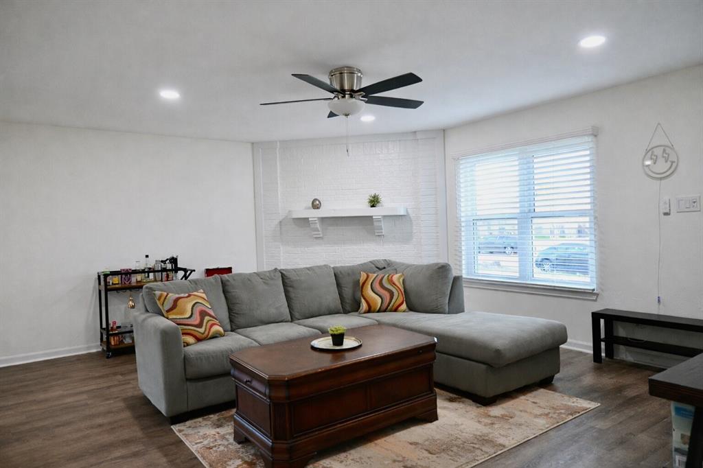2223 Ridgedale Drive Carrollton, TX 75006 - Photo 4 of 27 a living room with furniture and a window