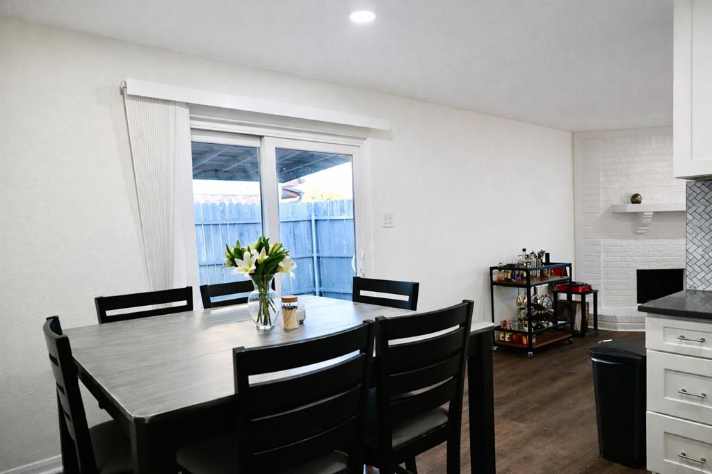 2223 Ridgedale Drive Carrollton, TX 75006 - Photo 7 of 27 a dining room with furniture and wooden floor