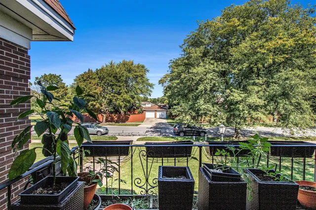 a view of a chairs and table in the balcony