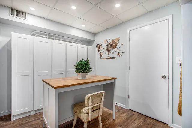 a workspace with furniture and wooden floor