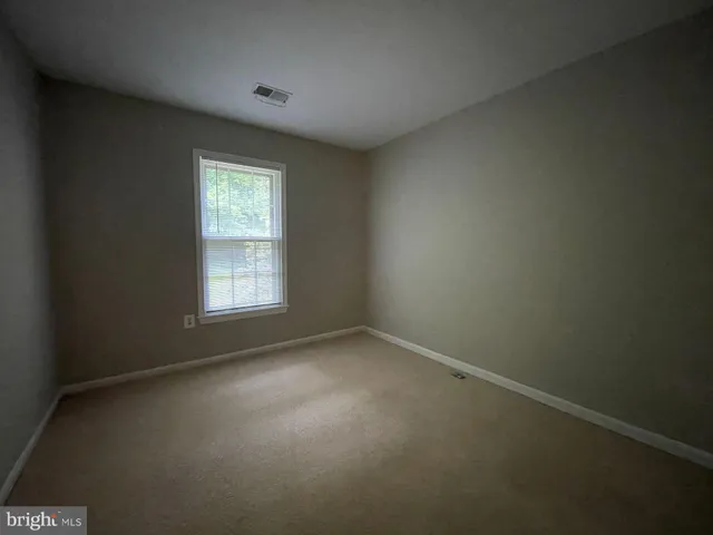 a bathroom with a toilet and a bathtub