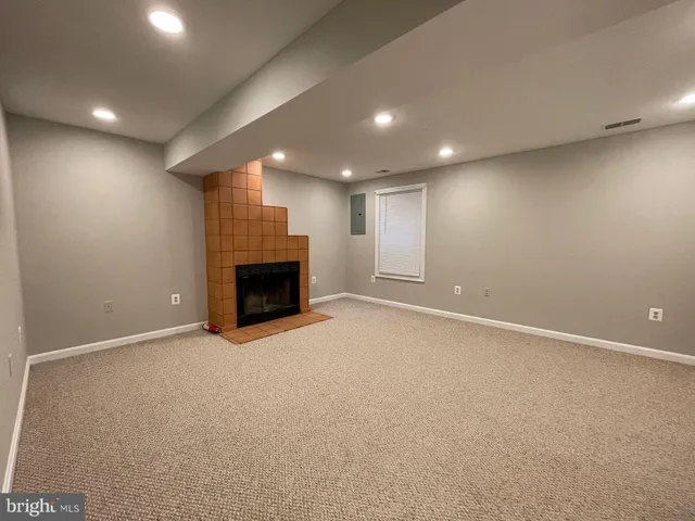 an empty room with a fireplace