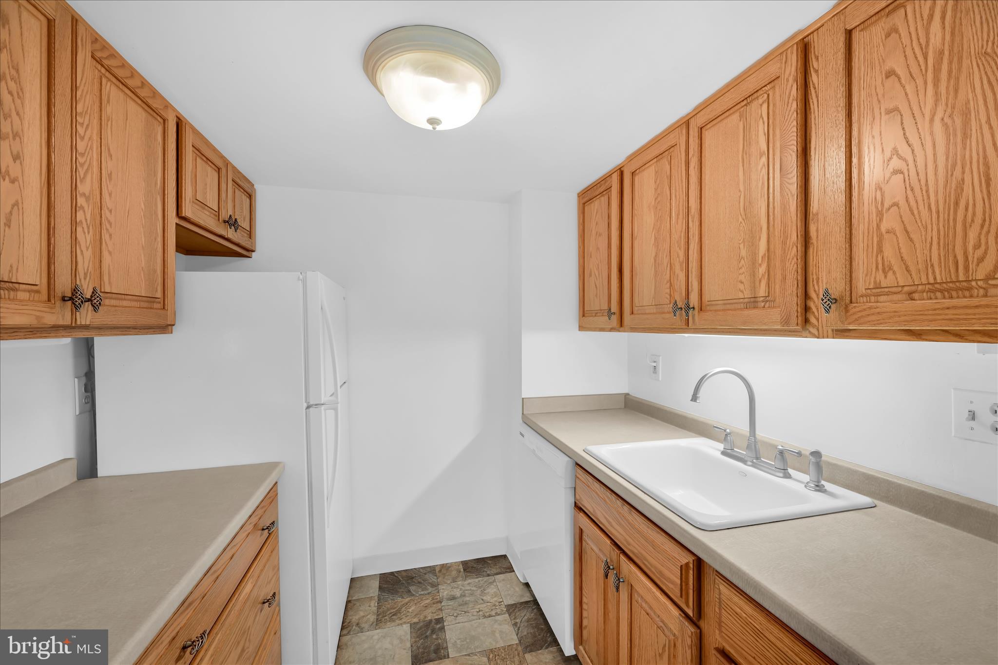800 Avondale Road, Unit 6P Wallingford, PA 19086 - Photo 16 of 27 a kitchen with stainless steel appliances granite countertop a sink and a stove