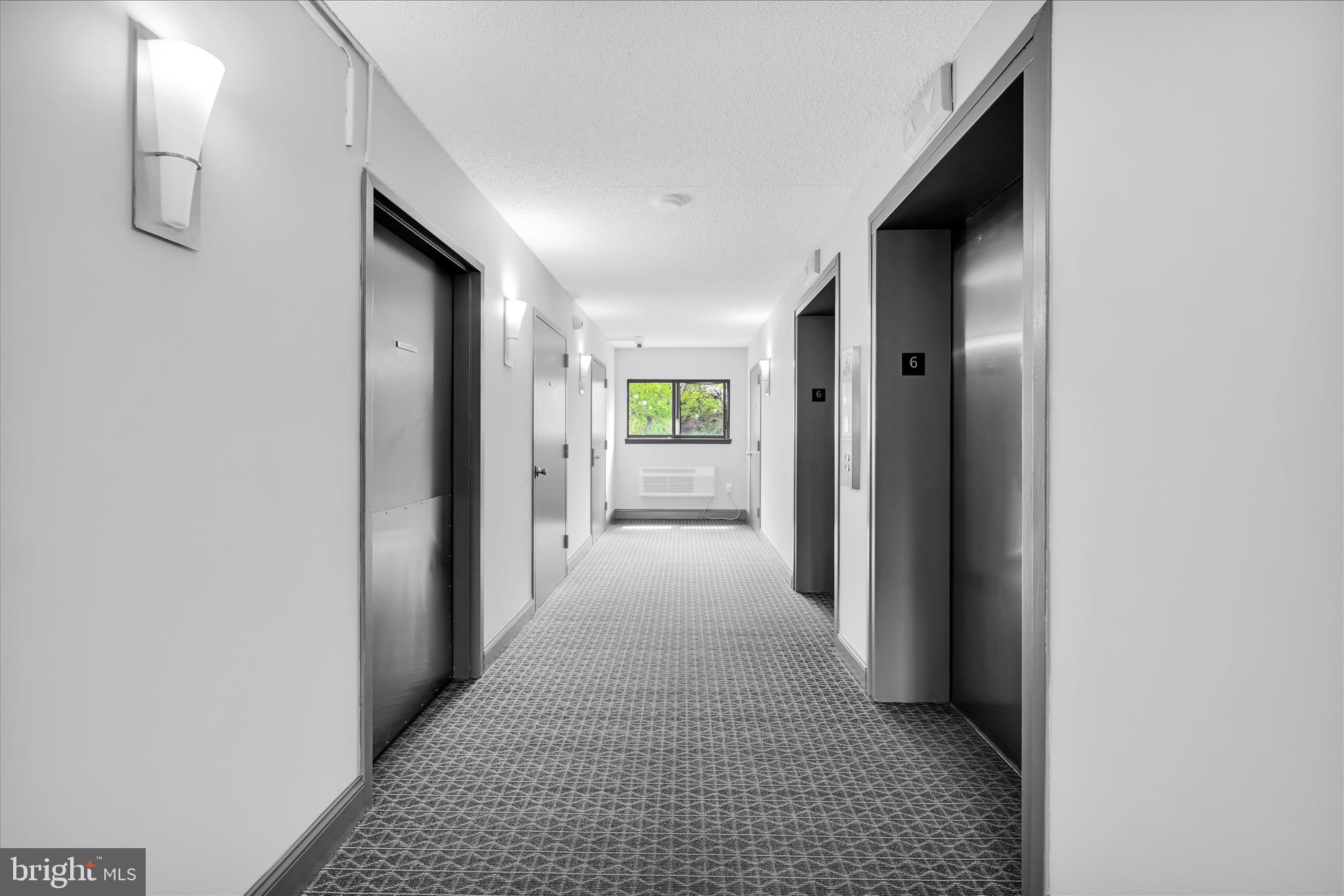 800 Avondale Road, Unit 6P Wallingford, PA 19086 - Photo 5 of 27 a view of hallway with livingroom and window