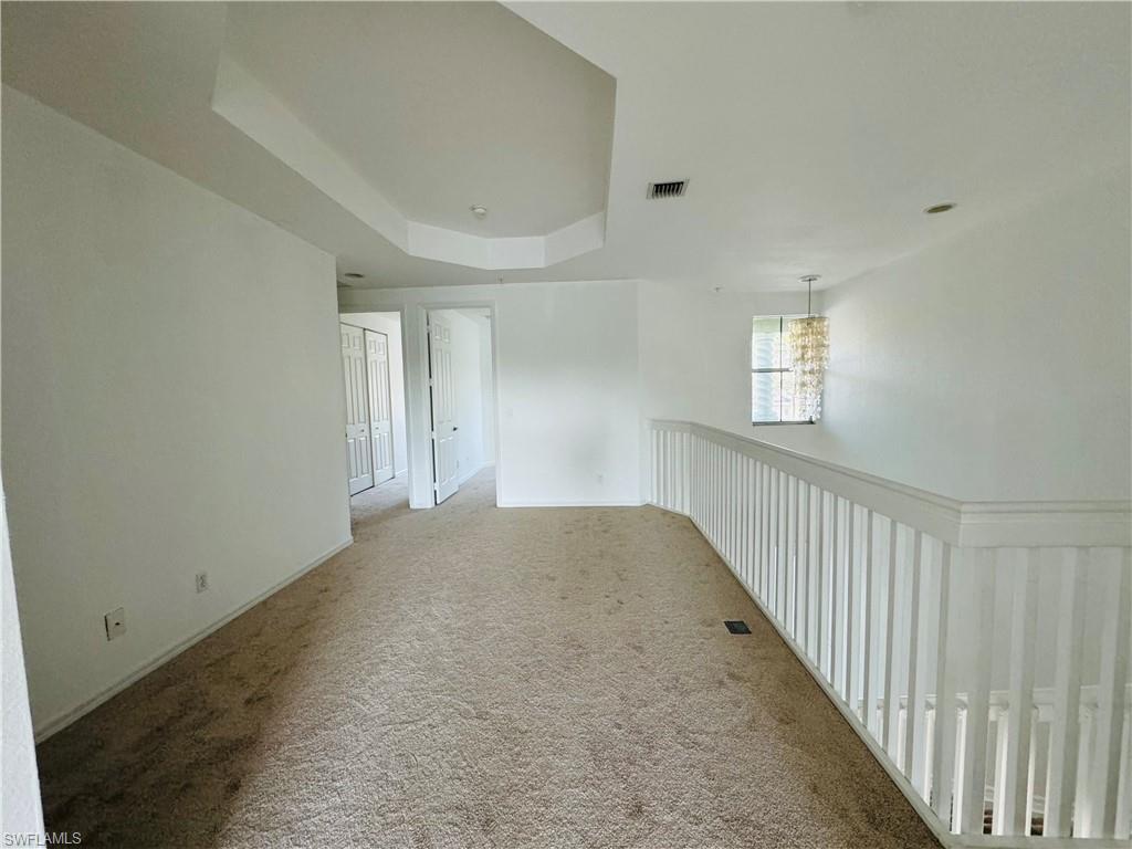1400 Mariposa Circle, Unit 103 Naples, FL 34105 - Photo 18 of 22 a view of an empty room and window