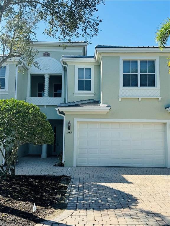1400 Mariposa Circle, Unit 103 Naples, FL 34105 - Photo 2 of 22 a view of a house with a barbeque
