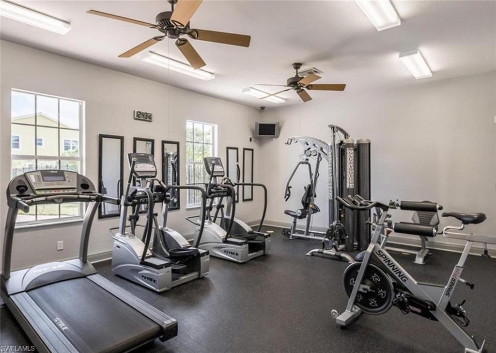 1400 Mariposa Circle, Unit 103 Naples, FL 34105 - Photo 21 of 22 a view of a room with gym equipment