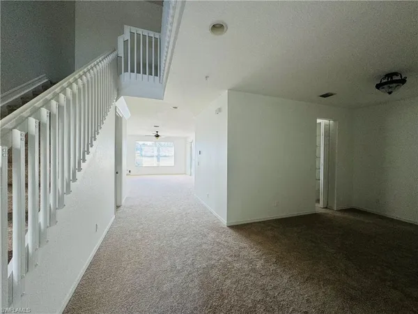 a view of a hallway with staircase