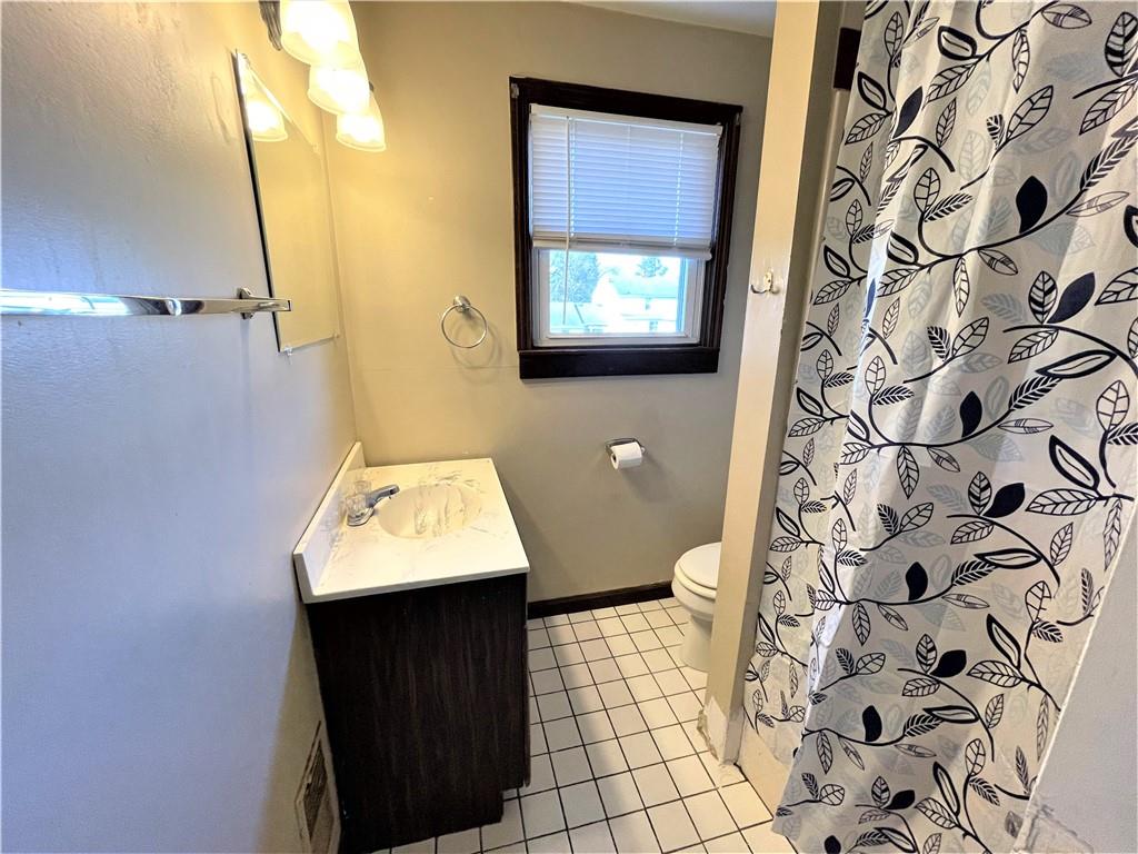 309 East Elizabeth Street New Castle, PA 16105 - Photo 13 of 13 a bathroom with a sink toilet and shower
