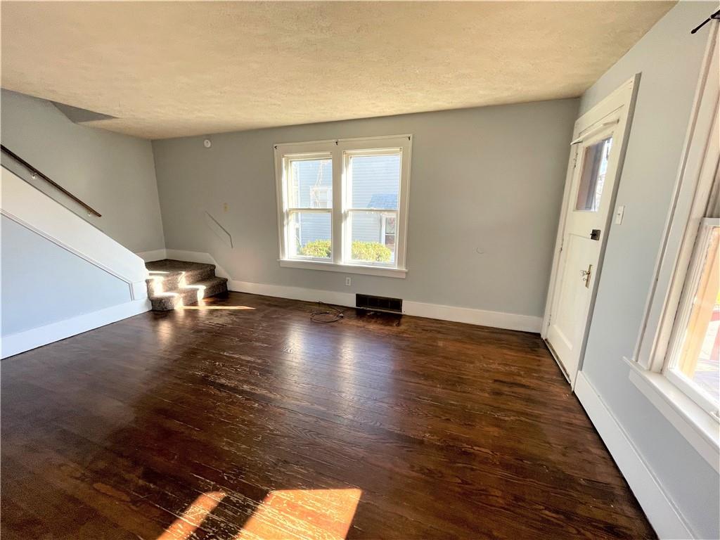 309 East Elizabeth Street New Castle, PA 16105 - Photo 2 of 13 a view of a room with wooden floor and a window