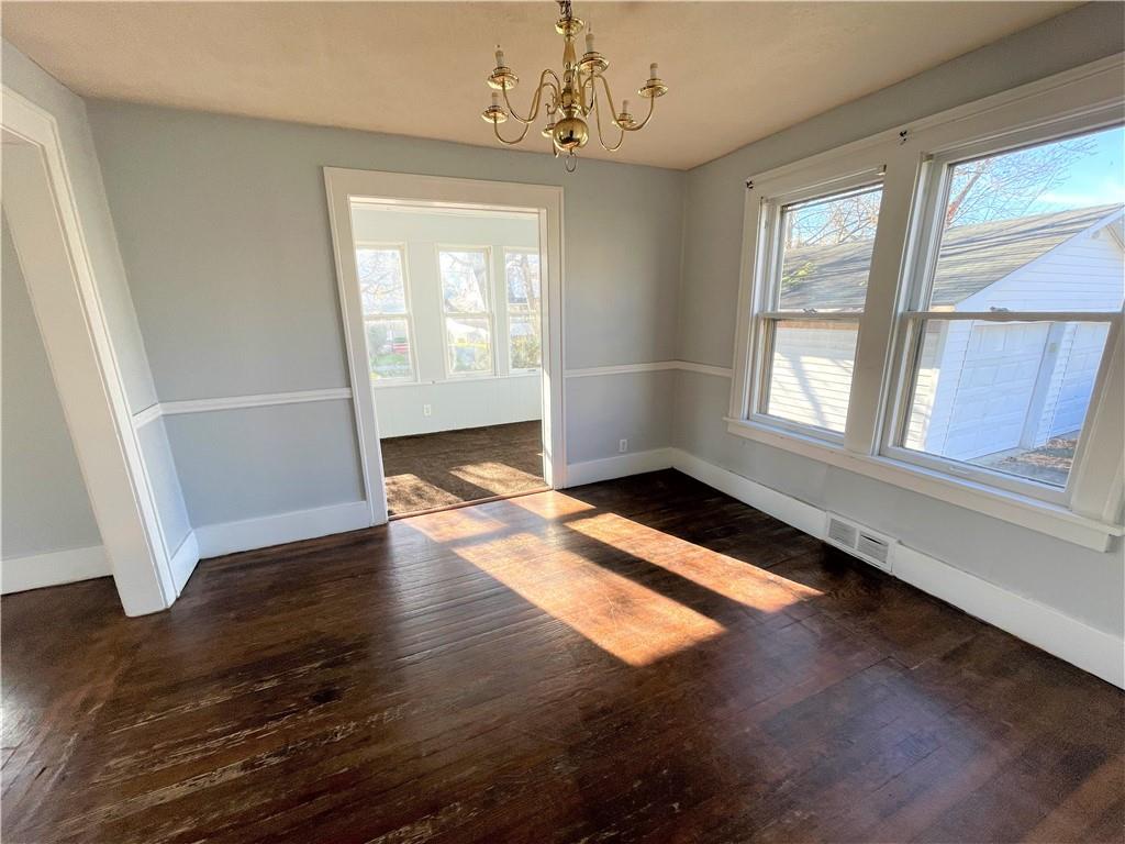 309 East Elizabeth Street New Castle, PA 16105 - Photo 4 of 13 wooden floor in an empty room with a window