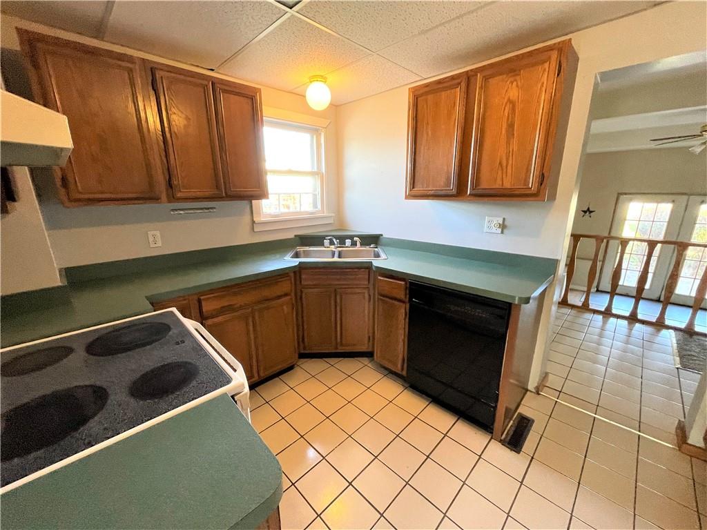 309 East Elizabeth Street New Castle, PA 16105 - Photo 7 of 13 a kitchen with stainless steel appliances a stove a sink and a microwave