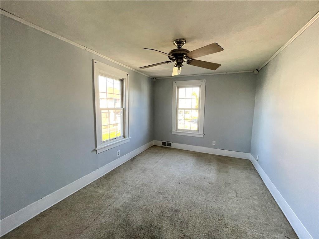 309 East Elizabeth Street New Castle, PA 16105 - Photo 10 of 13 a view of a livingroom with a ceiling fan and window