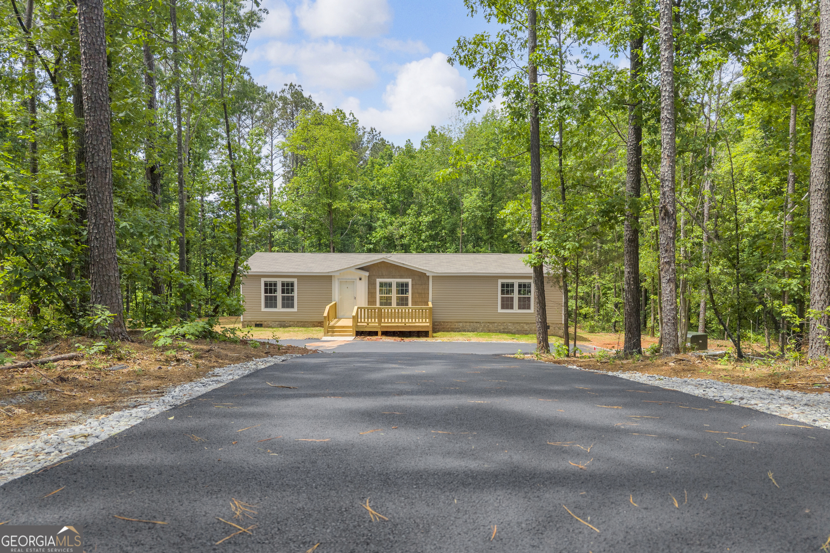 3442 Highway 29 Street South Colbert, GA 30628 - Photo 1 of 39 a front view of a house with a garden and trees