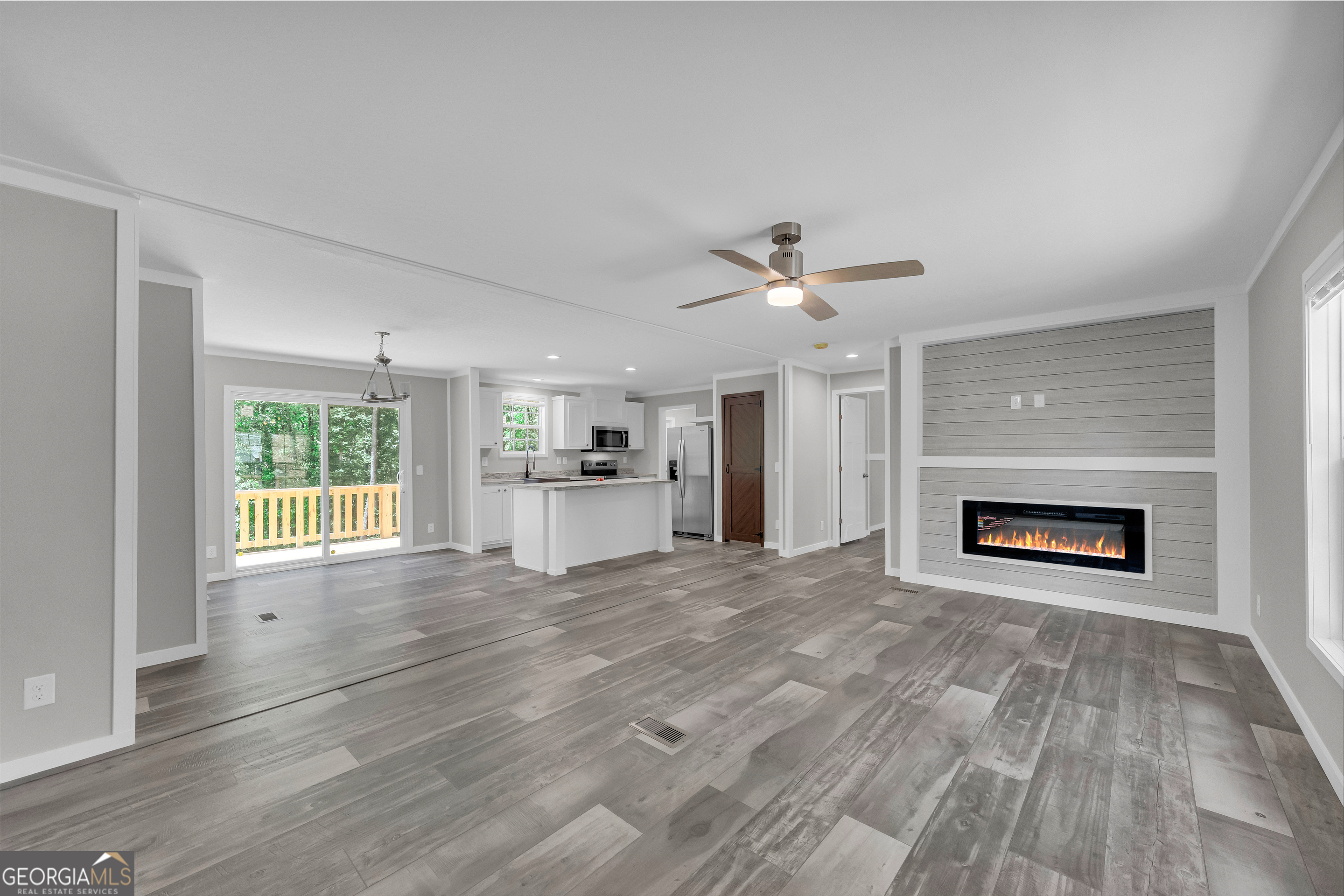 3442 Highway 29 Street South Colbert, GA 30628 - Photo 13 of 39 a view of empty room with wooden floor and fireplace